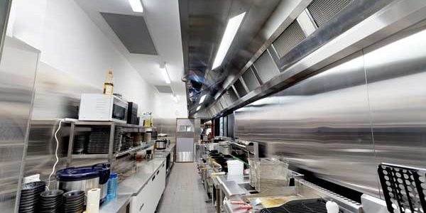 Long commercial kitchen exhaust canopy above a cooking line at Fukutontei Ramen